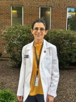 Sarwat Latif, physician assistant studies student, in white coat at the Midwestern University Downers Grove Campus.