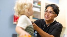 Clinical student examining child