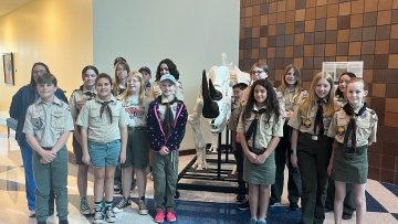 Group of Local Scout Troup Standing Near Rhino Skeleton.