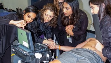 MWU students using ultrasound.