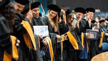 2025 College of Health Sciences, Glendale Campus graduates moving their tassels during commencement ceremonies