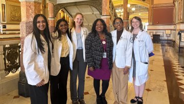 Group of students and state leaders at capitol