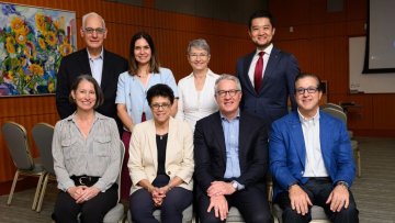 Dr. Brownstein sits with her working group of other leaders in dental education