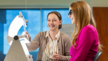 MWU Clinics optometrist performs eye exam.