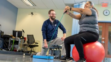 MWU Clinics physical therapist works with patient.