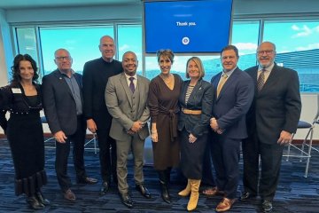Group of business leaders pose for photo