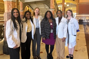Group of students and state leaders at capitol