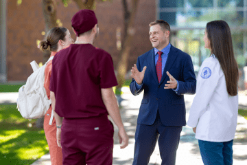 Joshua Baker, O.D., M.S., President and CEO of Midwestern University, speaking candidly with MWU students