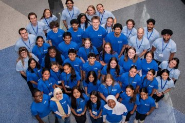 Students in a group posing for picture