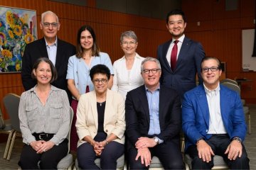Dr. Brownstein sits with her working group of other leaders in dental education