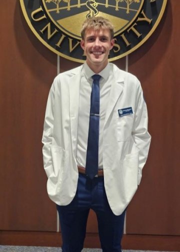 Dawson stands in front of seal