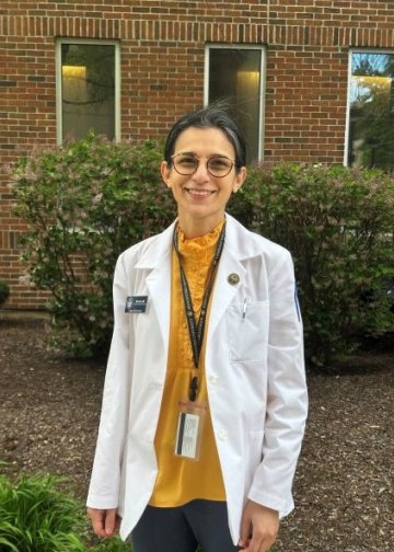 Sarwat Latif in white coat on Downers Grove Campus