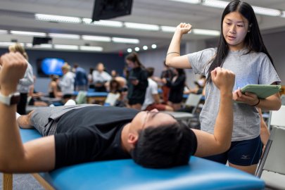 Two students in PT Lab
