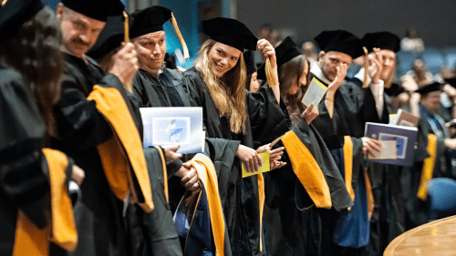 2025 College of Health Sciences, Glendale Campus graduates moving their tassels during commencement ceremonies