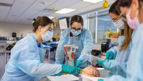Midwestern University students take a class in the anatomy lab.