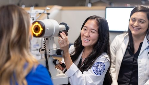 Faculty and students in optometry lab