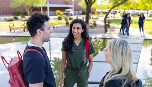 students talking on AZ campus outside