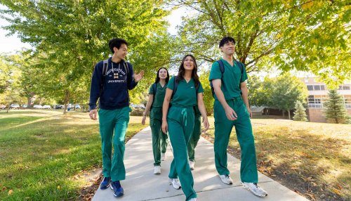 Group of students walking at the MWU Downers Grove campus.