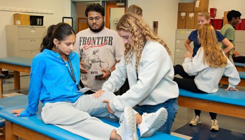 High school students learn physical therapy.