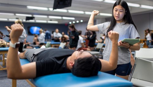 Two students in PT Lab