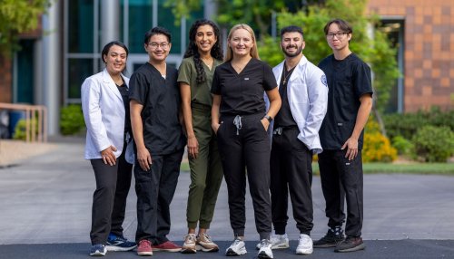 Students stand in front of building on Glendale Campus
