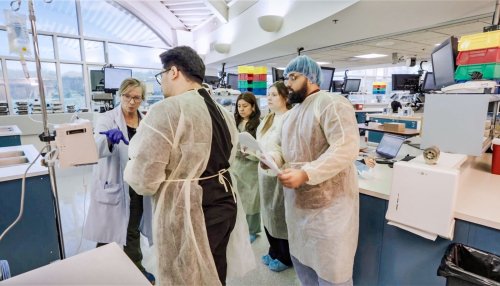 pharmacy students in lab with professor