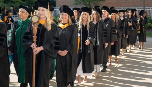 Graduates march across campus