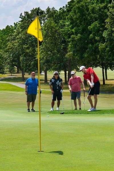Scholarship donors enjoy golf outing.