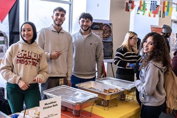 Students gather by the Palestinian dish Musakhan. 
