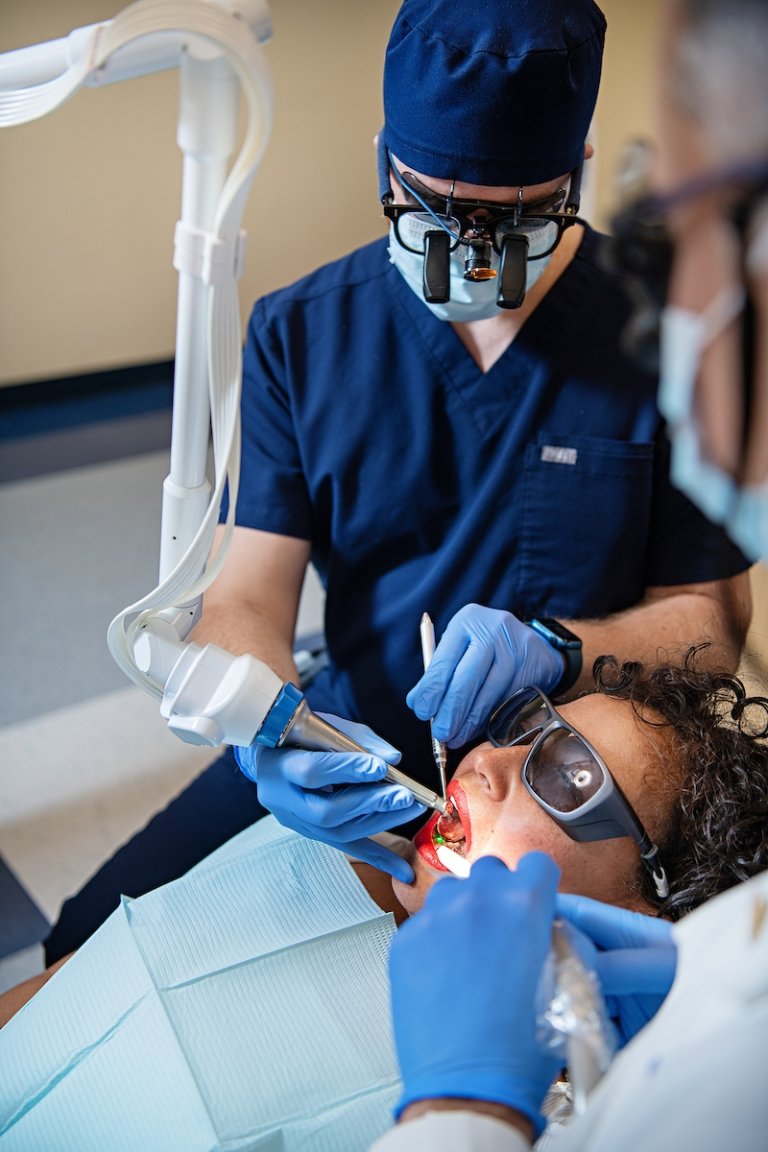 Student dentists give dental treatment.