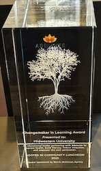 Award plaque with a white tree design.