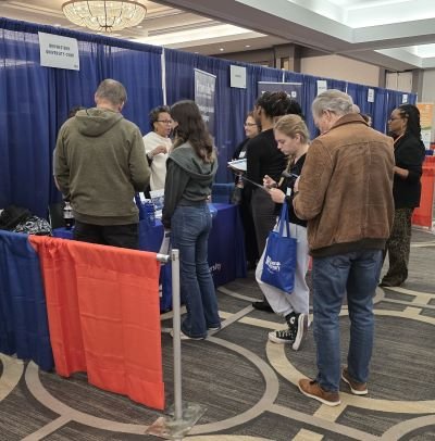 Students line up to speak to faculty at convention