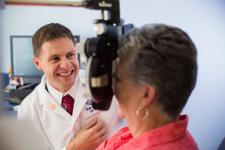 Dr. Baker performs eye exam on patient at the Midwestern University Clinics.