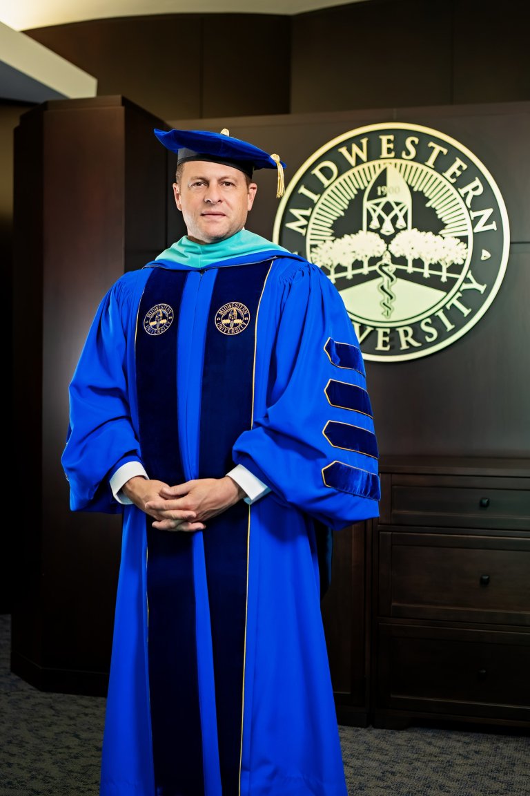 Dr. Baker dressed in academic regalia.